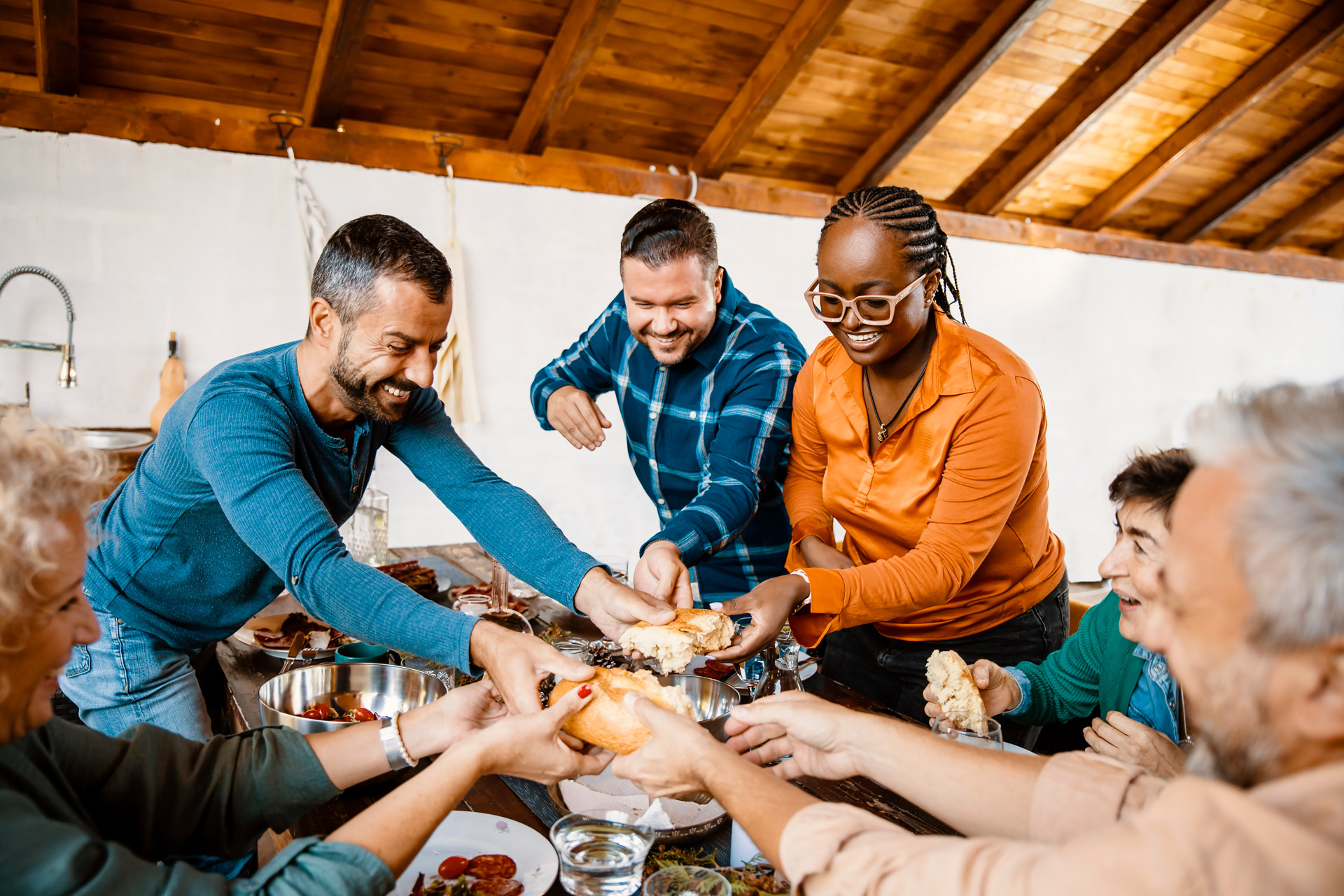 people around a table eating together